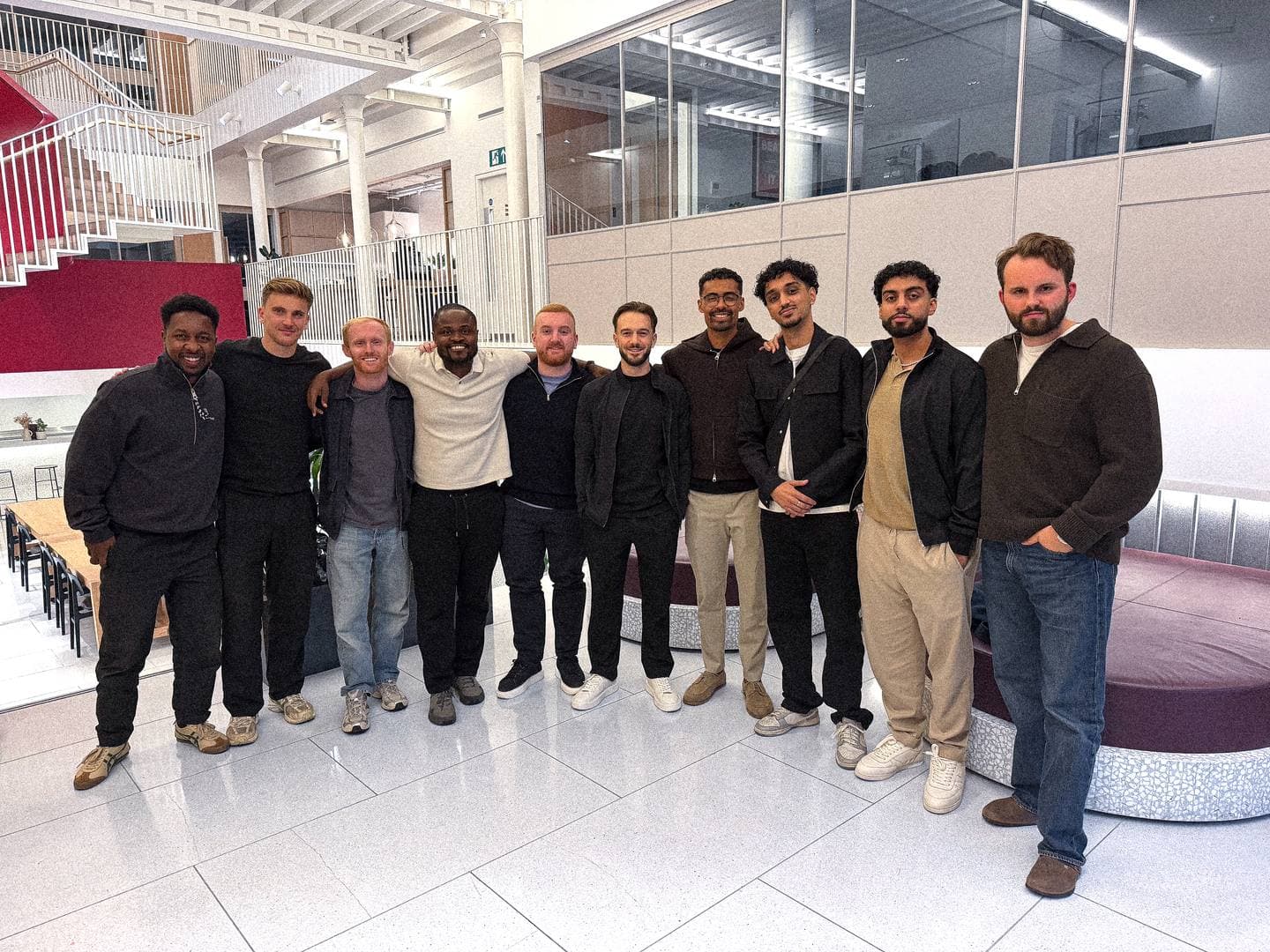 Joshua George with a group of founders who run growth for brands, standing together in a bright London office after a day-long meetup